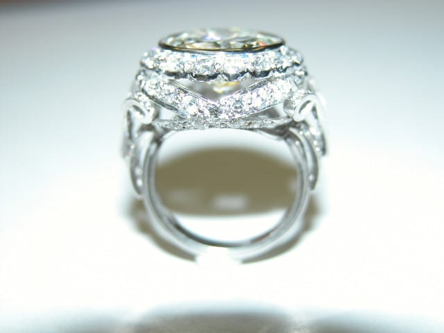 A close up of the ring with diamonds on it